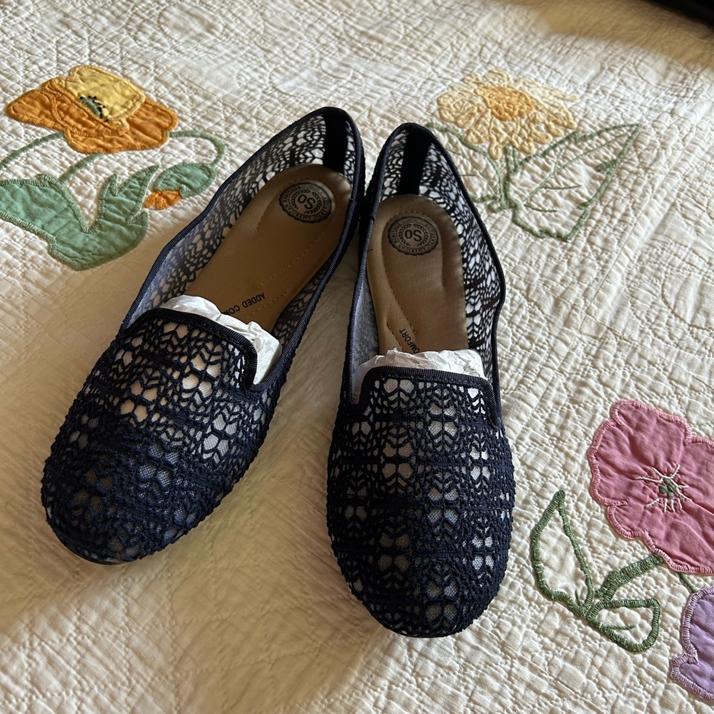 Navy blue lace flats from “SO”.